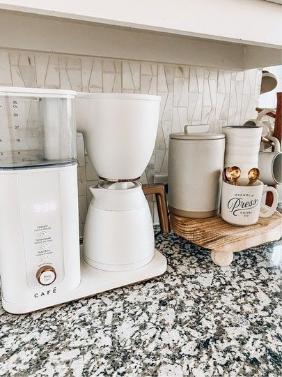 Small Kitchen Counter Coffee Station, White Keurig In Kitchen, White Coffee Maker On Counter, White And Gold Coffee Station, Kitchen Counter Coffee Corner, Coffee Bar Ideas Kitchen Counter Modern, White Coffee Maker, Coffee Pot On Counter Ideas, Coffee Maker On Counter Ideas