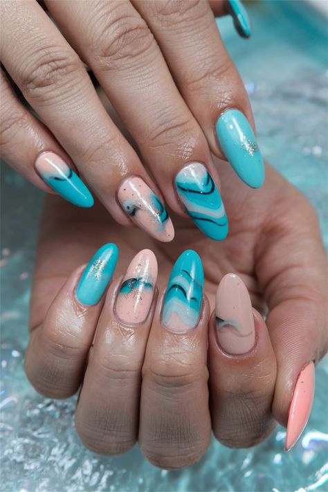 Dive into the essence of summer with these dreamy ocean waves nail design! This stunning look features a soft gradient of blues and turquoise, mimicking the calming movement of the sea. Accented with delicate white swirls and shimmering glitter, your nails will feel like a getaway in every glance. Embrace the vibrant spirit of the season with these captivating summer nail ideas that are bound to make a splash! Wave Nail Design, Wave Nails, Dreamy Ocean, Soft Gradient, Summer Nail Ideas, Summer Nail, Ocean Waves, Perfect Summer, Nail Design