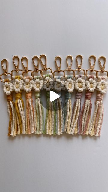 Megan Raleigh on Instagram: "Macrame Flower Keychains 🌼💚✨

#macrametutorial #macrametutorials #howto #macrame #megsmodernmacrame #shopmegsmodernmacrame #macrameshop #handmadecommunity #macramemakers #macramegift #macramebraid #braids #braidtutorial #howtomacrame #gatheringknot #beginnerknot #beginnermacrame #beginnerartist #macramemovement #fiberart #ornamentdiy #macrameornament #macramekeychain #macramecharm #fiberart #macramechristmas #relaxingtutorial #shophandmade #macramediy #macrameinstructions #macramestepbystep" Diy Boho Keychain Ideas, Easy Macrame Keychain, Macrame Keychain With Charm, Macrame Keychain Tutorial Video, Macrame Flower Keychain Tutorial, Macrame Flower Keychain, Daisy Macrame Keychain Tutorial, Flower Macrame Keychain, Macrame Flower Lanyard