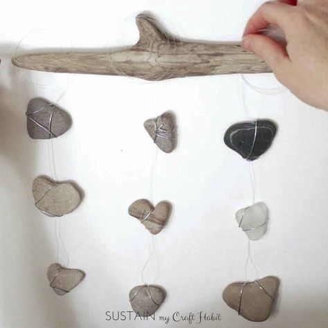 DIY Nautical Decor: Heart Rocks and Sea Glass Mobile #bedroom #decor #driftwood-crafts #heart #natural-decor #rocks #sea-glass #stones #valentines #wall-hanging#beach-decor #indoor-spaces #nature-crafts #sustainmycrafthabit Projects With Rocks, Diy Nautical Decor, Rock Creations, Diy Nautical, Heart Rocks, Glass Mobile, Heart Shaped Rocks, Nautical Diy, Rustic Wall Hangings