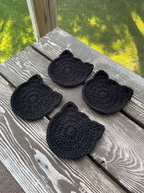 5x5in handmade black cat fall crochet coaster. Pattern by Busy Bee on YouTube :) Only comes with one, others sold separately. Fall Crochet Ideas Easy, Bee Coaster Crochet, Cat Coasters Sewing, Crochet Autumn Free Pattern, Apple Coaster Crochet Pattern, Crochet Projects With Black Yarn, Black Crochet Pattern, Crochet Skull Coasters Free Pattern, Halloween Crochet Ideas Easy