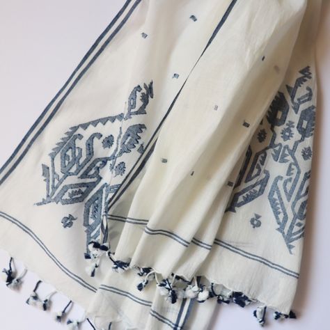 A small masterpiece of jamdani handloom weaving blooms each end of this fine off-white cotton scarf. Natural indigo-dyed; finished with two-tone tassels. handwoven and naturally dyed all cotton 27 x 80 inches Jamdani handloom textiles are woven by hand, by master craftspeople, without the use of electricity. Designs are woven into the fabric while it is on the loom. Each piece is individually hand-crafted. Care: hand wash gently in cool water, line dry in shade. Jamdani Scarves, Bird Stencil, Natural Indigo Dye, Handloom Weaving, Handloom Fabric, Handwoven Fabric, Indigo Dye, Fabric Remnants, Cotton Scarf