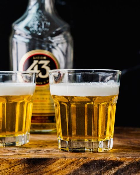 This Mini Beer Shot doesn't have beer at all! Here's how to make the popular little shot with Licor 43 liqueur and heavy cream. #minibeershot #littlebeershot #beershot #licor43 Little Beer Shots, Mini Beer Shots, Most Popular Alcohol Shots, Two Shots Of Vodka, Liquor 43 Shots, Key Lime Martini, Beer Shot, A Couple Cooks, After Dinner Drinks