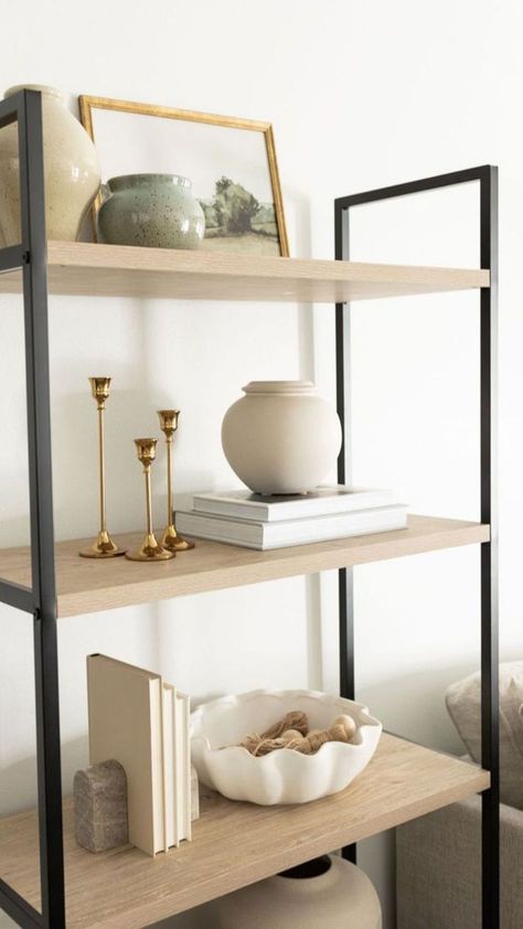 Discover the art of choosing the right shelves, whether it’s wood, glass, or metal, and how they can enhance the minimalist aesthetic. Learn about the importance of maintaining balance and contrast while arranging decor on shelves, following the Rule of Three for an appealing display. For more information, visit our website. Decor On Shelves, Minimalist Shelves Decor, Book Shelf Styling, The Rule Of Three, Minimalist Shelves, Shelf Decor Living Room, Styling Shelves, Rule Of Three, Bookcase Styling