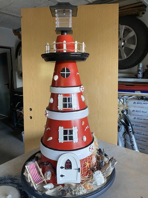 Clay Pot Lighthouse Diy, Clay Pot Lighthouse, Backyard Flowers Beds, Lighthouse Crafts, Terra Cotta Pot Crafts Diy, Lighthouse Decor, Clay Pot Projects, Diy Backyard Patio, Terra Cotta Pot Crafts