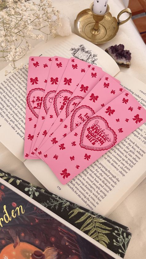 Handmade girly girl style bookmarks for book lovers. Bookmark Details:  - Bookmark dimensions: 15cm x 5cm - Printed in Greece on 400gsm textured matte card stock. - Bookmarks are available in different designs - Handmade by us. - Curved edge detail - Cute baby pink gingham pattern at the back Feel free to message me for any further questions or concerns! Mimi Coquette Bookmark, Pink Bookmark, Bookmark Dimensions, Romance Reader, Bookmarks For Books, Cute Bookmarks, Romance Readers, Gingham Pattern, Bookmarks Handmade