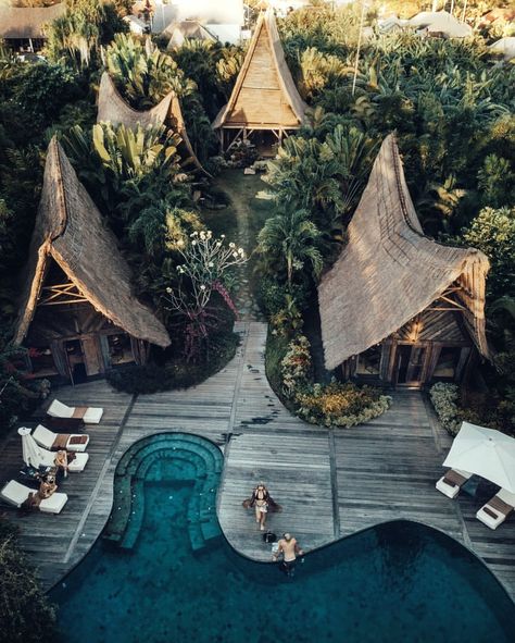 Beautiful golden hour drone shot of Own Villa - located between Canggu and Seminyak in Bali, Indonesia - recycled wood, curved infinity pool, and lush tropical greenery make up this intimate and unique eco-resort #concioustravel #travel #beautifuldestinations #wheretostay #balivilla #balihotel #designhome #architecture #design #archilovers #uniquearchitecture #creativelife Bali Resort Architecture, Bali Resort Villa, Eco Resort Architecture, Tropical Resort Design, Image Zen, Jungle Resort, Voyage Bali, Villa Bali, Bali Resort