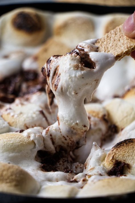 If you've always wanted to bring the campfire experience to your backyard, I have just the solution with this delicious Traeger s'mores dip. This dip is packed with gooey marshmallows, rich melted chocolate, and plenty of sugary goodness. This one-pot wonder promises to be a hit at your next party. Smoked Smores Dessert, Traeger Grill Dessert Recipes, Traeger Smoked Dips, Smoked Smores Dip, Traeger Dip Recipes, Pellet Grill Dessert Recipes, Smoked Smores, Traeger Dessert Recipes, S’more Dip