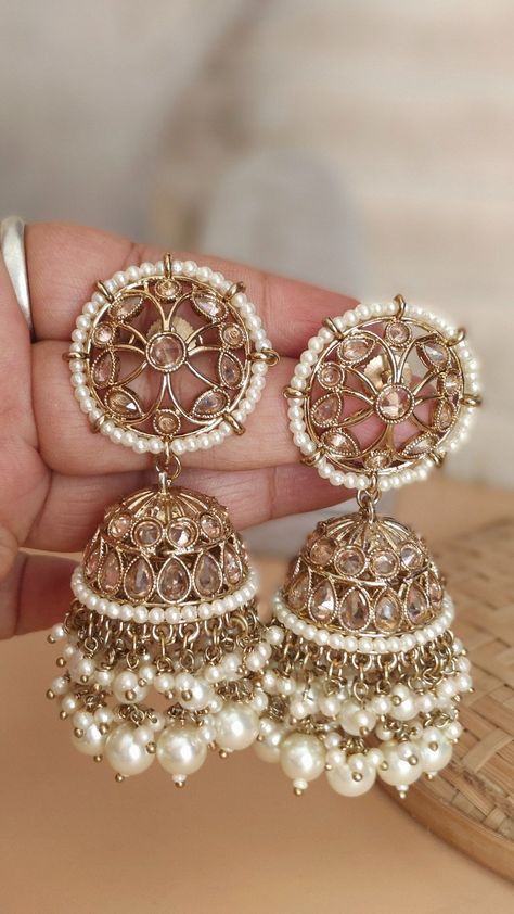 Fine Victorian Uncut Polki Kundan Diamond Jhumka | Pearl Gemstone Earring |  Promise Jewelry | Earring Dangle | Gold Pearl Western Jhumki Elevate your style with the timeless elegance of our Exquisite South Indian Kundan Jhumka. These traditional earrings are a perfect blend of sophistication and cultural heritage, exuding charm and grace with every sway. Crafted with utmost precision, these jhumkas showcase intricate Kundan work, a hallmark of South Indian jewelry craftsmanship. The dazzling array of uncut gemstones set in rich gold plating adds a touch of opulence to your ensemble, making them perfect for special occasions and celebrations. Whether you're a bride looking for the perfect accessory to complement your wedding attire or someone who appreciates the allure of Indian jewelry, o South Indian Jhumka, Indian Earrings Jhumka, Jhumkas Gold, Pearl Jhumkas, Kundan Jhumka, Gold Earrings Indian, Promise Jewelry, Gold Jhumka Earrings, Kundan Work