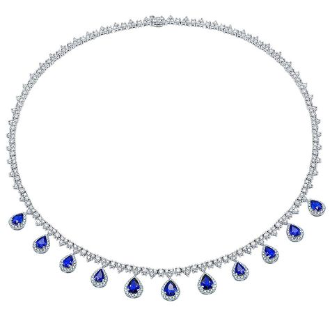 This absolutely stunning necklace is sure to be loved and cherished. This 18 karat white gold necklace made from 35 grams of white gold sparkles with 426 round VS2, G color diamonds totaling 12.16 carats of white diamonds. The diamonds are on the main part of the necklace and halo the 11 pear-shaped sapphires that hang down from the main band of the necklace. The celon sapphires total 9.25 carats and are a beautiful shade of blue. Diamond And Sapphire Necklace, Blue Necklaces, Blue Diamond Necklace, Sapphire Diamond Necklace, Expensive Diamond, The Bling Ring, Necklace With Diamond, Blue Sapphire Necklace, Expensive Jewelry Luxury