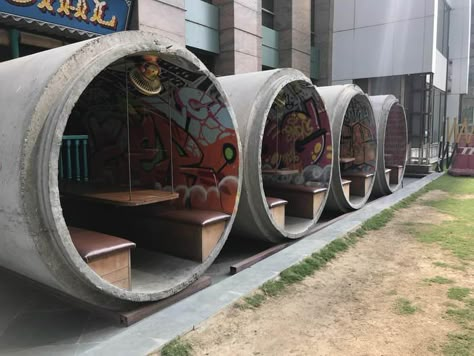 This restaurant uses concrete sewer pipes for outdoor seating Container Home Designs, Container Restaurant, Container Cafe, Outdoor Restaurant Design, Coffee Shop Design, Outdoor Restaurant, Container House Design, Cafe Interior Design, Cafe Shop