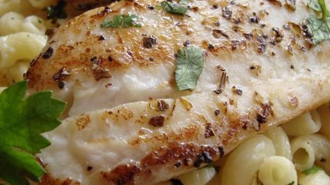 Tender tilapia fillets are seasoned with lemon and herbs, and served over Parmesan pasta for a light, fresh taste. Tilapia And Pasta Recipes, Tilapia Pasta, Cooking Tilapia, Lemon Tilapia, Fish Pasta, Seafood Meals, Pastas Recipes, Baking Secrets, Cheese Crust