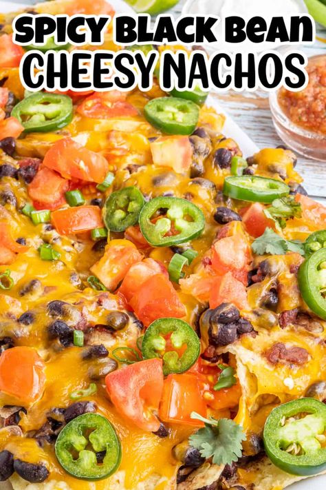 Nachos are a classic snack for just about any occasion – especially if they’re topped with melted cheese and spicy beans! And when you use your oven to bake them on a sheet pan, you have a delicious snack that’s also easy to prepare. That’s why this recipe for spicy black bean nachos is sure to be a hit at any get-together. Everyone will love the crispy chips topped with cheese and a spicy bean mixture, making it perfect for a party. Black Bean Nachos Recipe, Healthy Sheet Pan Nachos, Oven Nachos Recipes, Beans For Nachos, Bean And Cheese Nachos, Bean Nachos Recipe, Oven Nachos, Spicy Nachos, Classic Nachos