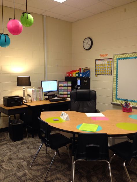 Teachers desk with kidney table. Dry erase circles for kids to practice during small group. Teacher Desk And Kidney Table, Teacher Desk Small Group, Teacher Desk And Kidney Table Set Up, Teacher Desk Kidney Table, Teacher Desk With Kidney Table, Teacher Kidney Table Desk, Kidney Desk Classroom, Teacher Desk With Small Group Table, Kindergarten Teacher Desk Area