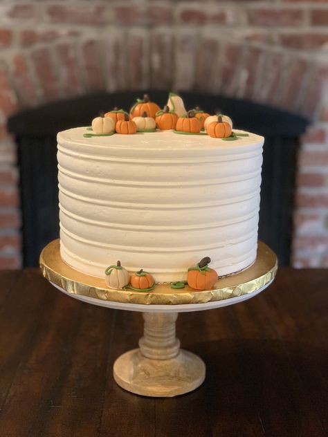 A Thanksgiving Pumpkin Spice cake with Pumpkin buttercream and fondant pumpkin decorations. Pumpkin Spice Birthday Cake, Pumpkin Theme Dessert Table, Fall Gender Reveal Cake, Pumpkin Theme Baby Shower Cake, Fall Theme Baby Shower Cake, Pumpkin Themed Cake, Cake Pumpkin Theme, Spice Cake With Pumpkin, Pumpkin Cake Design