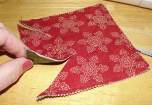 Quilted Christmas Ornaments How To Make, Cloth Ornaments Diy, Sewn Christmas Ornaments Sewing Patterns, Easy Sewn Christmas Ornaments, Fabric Snowflakes Pattern, Handmade Christmas Decorations Sewing, Quilted Tree Ornaments, Christmas Package Decorations, Pinwheel Ornaments How To Make