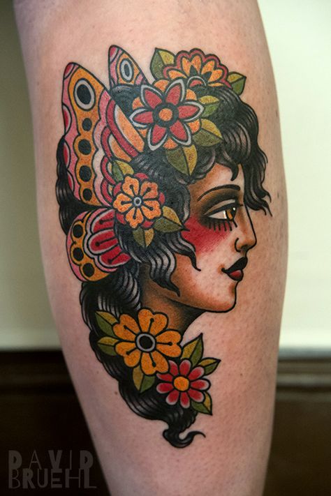 Tradtional tattoo of a woman's face with butterfly wings and flowers on a leg. By David Bruehl at RedLetter1 in Tampa, Florida Butterfly Lady Tattoo, Butterfly Woman Tattoo, Traditional Tattoo Face, Tattoo Woman Face, Traditional Tattoo Woman Face, Trad Sleeve, Face With Butterfly, Flower Tats, Traditional Moth Tattoo