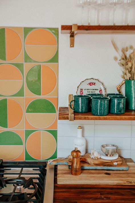 Before You Splurge on Backsplash Tile, Consider This Clever Hack #SOdomino #room #interiordesign #wall #furniture #yellow #kitchen #tile #orange #green Orange Kitchen Backsplash Ideas, Orange And Green Tiles, Orange Kitchen Tiles Backsplash Ideas, Kitchen Tile Ideas Wall, 70s Kitchen Backsplash, Eclectic Kitchen Backsplash, Green Orange Kitchen, Orange Backsplash Kitchen, Colourful Backsplash