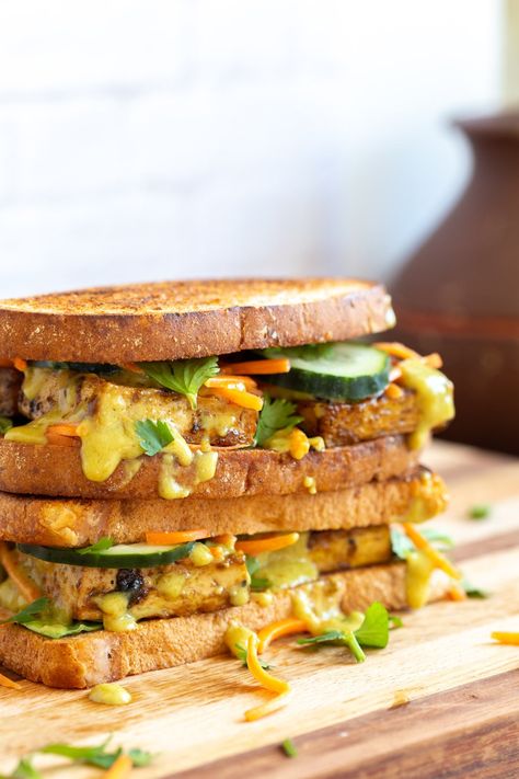 Curried Tofu Banh Mi Sandwich stacked on a wood board Vegan Banh Mi, Curried Tofu, Tofu Banh Mi, Best Tofu Recipes, Banh Mi Recipe, Banh Mi Sandwich, Vegan Sandwiches, Coconut Curry Sauce, Vegan Richa