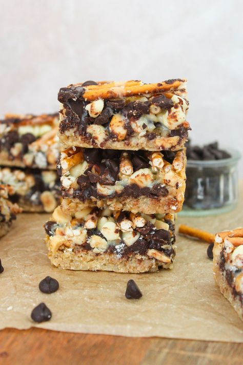 Oatmeal Cookie Magic Bars - Taffey Bakery Taffey Bakery, Seven Layer Bars, Layer Bars, Magic Bars, Pretzel Sticks, Oatmeal Cookie, Quick Oats, Fudgy Brownies, Brownie Bar