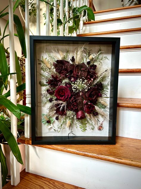 Dried flowers are preserved in a black shadow box. Bridal Bouquet Preservation, Wedding Flower Preservation, Scrabble Wall Art, Flower Shadow, Wedding Bouquet Preservation, Floral Preservation, Flower Preservation, Flower Shadow Box, Bouquet Preservation