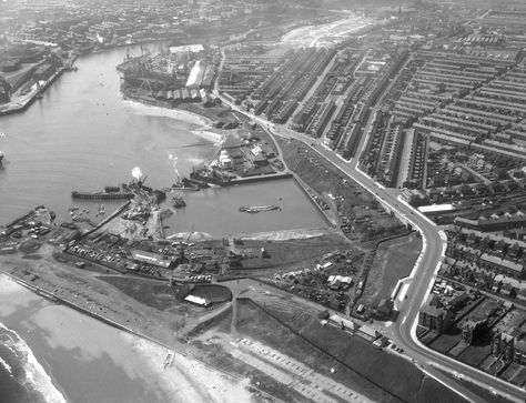 Aerial view looking up the River Wear, with the North Dock in the foreground and the North Sands shipyard in the background, May 1959 (TWAM ref. DT.TUR/2/22167A). This set of aerial images is intended as a short historical tour of the River Wear from the Piers to Pallion. It gives us an impression of what the River looked like during the middle years of the Twentieth Century, when it was a hive of industrial activity. Sunderland had an international reputation for shipbuilding an... South Tyneside, Marine Engineering, Victorian Buildings, Aerial Images, Aerial Photograph, Tyne And Wear, Down The River, Newcastle Upon Tyne, Train Tracks