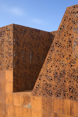 CaixaForum Madrid, Spain by Herzog & De Meuron |Pinned from PinTo for iPad| Steel Architecture, Metal Facade, Peter Zumthor, Weathering Steel, Amazing Buildings, Building Facade, Corten Steel, Architecture Exterior, Facade Architecture