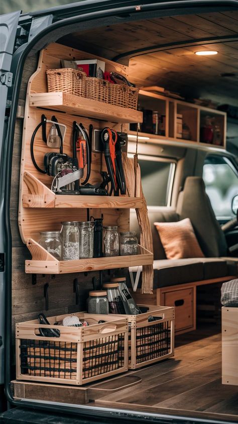 A DIY van conversion featuring a functional gear wall with farmhouse-style storage and flip tables. Van Drawers Storage Ideas, Diy Van Storage Ideas, Van Drawers, Diy Van Interior, Campervan Storage Ideas, Vw Wagon, Van Organization, Troop Carrier, Gear Wall