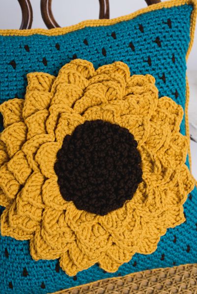 Here Comes the Sunflower Pillow - I Like Crochet Crochet Sunflower Cushion, Crocheted Sunflowers, Crochet Flower Pillow, Crochet Sunflowers, Crocheted Sunflower, Crochet Pot Holders Free Pattern, Crochet Pillow Cases, Crochet Project Free, Puff Flower