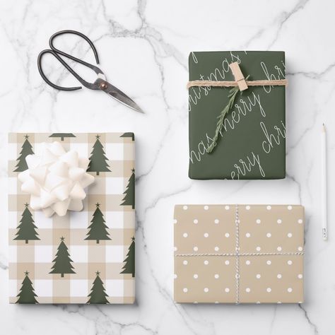 A collection of coordinated holiday wrapping papers. One features a beige gingham background with a green Christmas tree pattern, the second is a tan background with a white polka dot pattern and the third is a coordinating green with merry christmas. Mix and match.