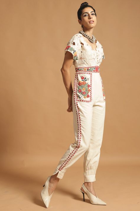 Featuring an ivory jumpsuit in kala cotton base with beads and cutowrk embroidery.   FIT: Fitted at bust and waist. COMPOSITION: Kala cotton. CARE: Dry clean only. Ivory Jumpsuit, Embroidered Jumpsuit, Designer Jumpsuits, Cotton Jumpsuit, Jumpsuit Online, Indian Fashion Designers, White Jumpsuit, Cut Work, Jackets Online