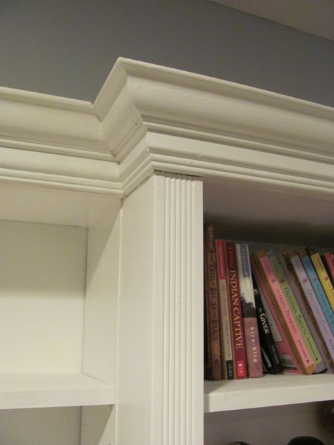 We found some lovely, wide crown moulding and some fluted trim at Habitat REstore (if you have a Habitat for Humanity REstore near you, you ought to check it out!  The prices are amazing!)  Since this was going to be a long wall of shelves, we divided it up into thirds and bumped out the center section to add visual interest. Built In Bookshelves Crown Molding, Bookshelf Molding, Bookshelf Furniture, Moulding Ideas, Molding Detail, Classic Bookshelves, Entertainment Rooms, Molding Ideas, Wood Library