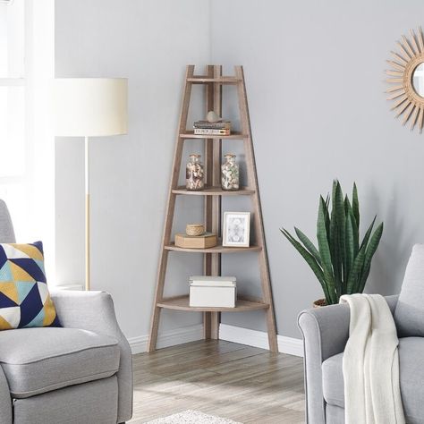 A corner bookcase, so even the smallest apartments can get some extra stylish storage space. Corner Ladder Shelf, Display Bookshelf, Ladder Display, Furnitur Ruang Keluarga, Decorative Shelving, Corner Bookshelves, Corner Space, Shelf Bookcase, Ladder Shelf