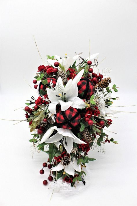 That winter floral arrangement feels elegant for your special day. Trust me, this floral selection elevates your wedding style. Add this bouquet to your winter bouquet ideas. Winter Floral Arrangements, Christmas Bouquet, Winter Bouquet, Winter Floral, Bouquet Ideas, Floral Arch, Wedding Flower Arrangements, Fake Flowers, Floral Arrangement