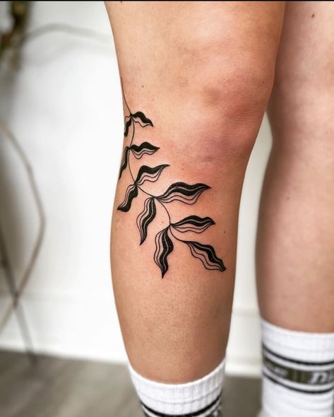 Tattoos That Bend, Negative Space Band Tattoo, Trad Leg Tattoos Women, Knee Arch Tattoo, Earthy Flash Tattoo, Leg Fern Tattoo, Bold Lines Tattoo, Foliage Leg Tattoo, Kaytranada Tattoo