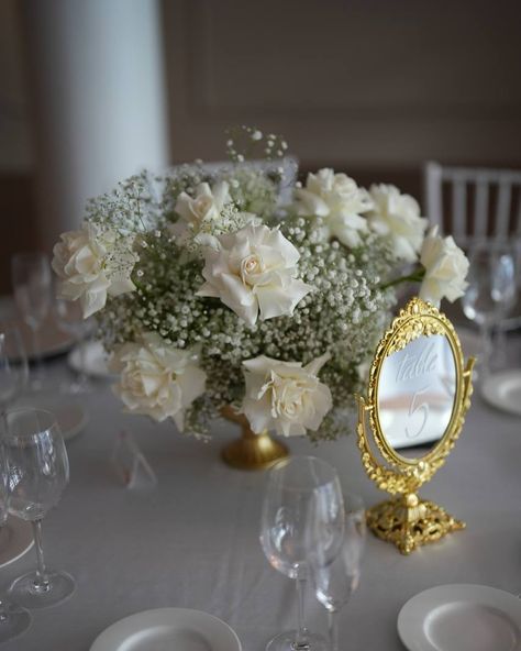 To classic flowers of weddings - roses and baby’s breath! These timeless florals make their way into nearly every wedding, and look equally stunning in any arrangement, color scheme, and format! This wedding made the most of white reflexed roses that added texture and elegance, as well as baby’s breath that added lightness and volume to the wedding! Bud vases, centerpieces, table decor and more - everything is possible! To find out more, schedule a wedding consultation by calling or textin... Babies Breath And Roses Centerpiece, Roses And Baby Breath Centerpiece, Baby’s Breath Wedding Centre Pieces, Baby Breath Centerpiece, Wedding Bud Vases, Reflexed Roses, White Rose Centerpieces, Centerpieces Table, Vases Centerpieces