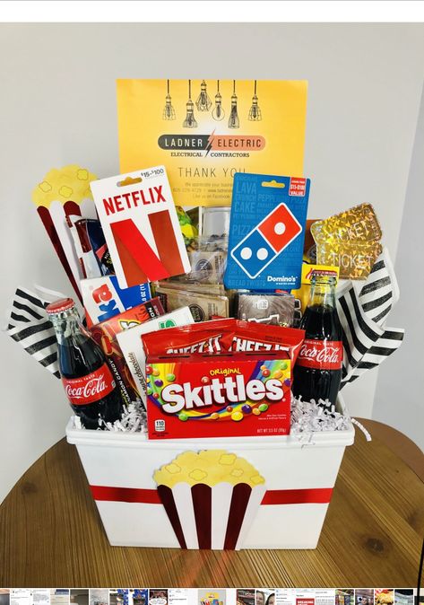 Gift Baskets Ideas For Raffles, What To Put In A Movie Night Gift Basket, Movies Basket Ideas, Movie Themed Basket Ideas, Movie Night Prize Basket, Bingo Night Prizes Gift Ideas, Movies Gift Basket Ideas, Popcorn Raffle Basket Ideas, Silent Auction Gift Basket Ideas Christmas