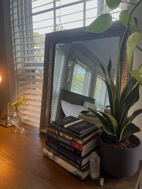 Book stack, plants, vintage gold mirror Mirror With Plants, Vintage Gold Mirror, Plants Vintage, Earthy Bedroom, Candle Mirror, Book Stack, Bedroom Mirror, Living Styles, Light Academia