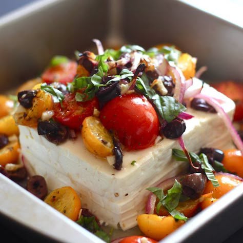 Baked feta topped with tomatoes, olives, red onion and fresh herbs. Serve with pita chips! It's great for parties. Baked Feta With Tomatoes, Feta With Tomatoes, Baked Feta, Pita Chips, Party Food Appetizers, Aioli, Greek Recipes, Appetizers For Party, Mediterranean Recipes