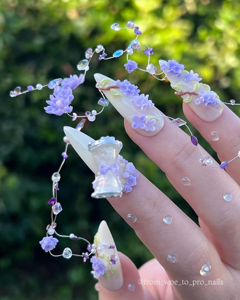 Met Gala After Party! I’ve been having so much fun with my 3D molds, and syrup gels from Leav, I decided to create an after party look for my nails. This time they are a little more garden party, and I’ve added a working hourglass that turns. I hope you like them! 🩶 Leav Filter Collection @leavnail_official_global available from @zillabeau 💵 Codes: WOETOPRO saves you 10% at Zillabeau See my instagram story highlights to save on brands I love. 🤍 #nailsofinstagram #nailart #nail... Flower Fairy Nails, Purple Fairy Nails, Blue Fairy Nails, 3d Flower Charm Nails, 3d Sculpted Flower Nails, Brand Me, 3d Nails, Party Looks, Nail Artist