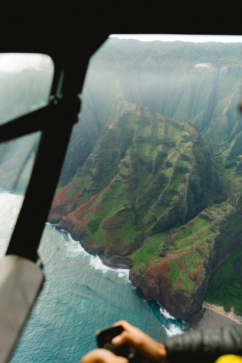 green and brown mountain beside body of water during daytime photo – Free Outdoors Image on Unsplash Na Pali Coast Kauai, Hawaii Bucket List, Na Pali Coast, Hawaii Pictures, Hawaii Travel Guide, Best Honeymoon Destinations, Honeymoon Spots, Helicopter Ride, Best Honeymoon