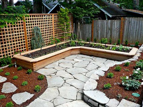 An L-shaped vegetable raised bed hugs the northeast corner of the lower backyard, with a tall trellis forming the backdrop and giving privacy, late May Raised Garden Bed Corners, Beautiful Raised Garden Beds, Backyard Garden Beds, Small Courtyard, Backyard Garden Layout, Building A Raised Garden, Backyard Garden Landscape, Corner Garden, Small Backyard Gardens