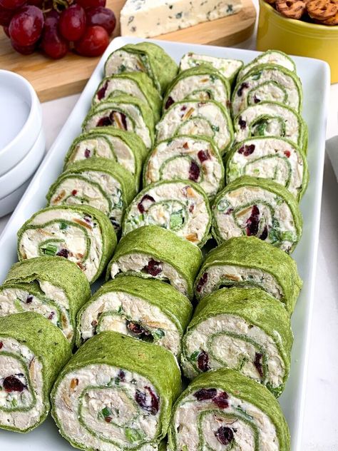 are filled with chicken, almonds, cranberries, green onions, and feta, rolled up in spinach tortillas. A great appetizer for parties -- and they taste even better than they look. As an Amazon Associate I earn from qualifying purchases. You Tortilla Pinwheel Appetizers, Chicken Cranberry Salad, Pinwheel Sandwich Recipes, Tortilla Pinwheels Recipe, Spinach Tortillas, San Patrizio, Chicken Cranberry, St Patricks Food, Chicken Pinwheels