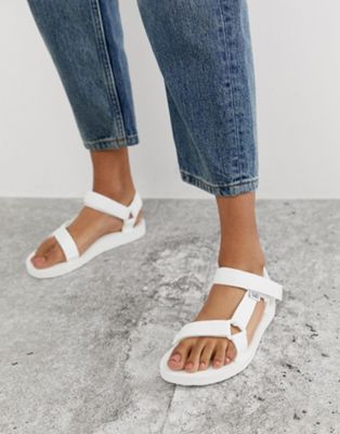 Teva Original Universal sandals in white White Teva Sandals, White Teva, Teva White, Heel Sandals Outfit, Teva Original Universal, Shoes For School, Teva Sandals, Sandals Outfit, Teva Shoes