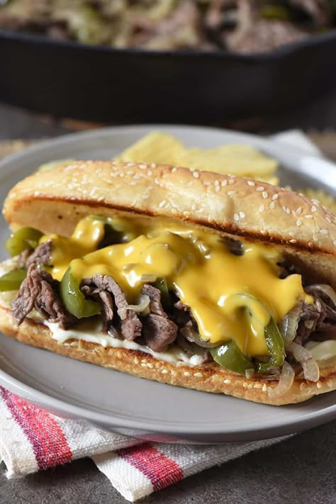 How to make the best homemade Philly Cheesesteak, including tips for the best steak, cheese, and hoagie rolls to use. This is one easy skillet meal you can make for dinner, and the whole family will love it! Finger Sandwiches For A Crowd, Roast Beef Lunch, Meatballs Ground Beef, Philly Cheese Steak Sandwich Recipe, Homemade Philly Cheesesteak, Cheese Steak Sandwich Recipe, Sandwiches For A Crowd, Philly Steak Sandwich, Best Philly Cheesesteak