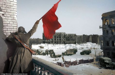 A Russian soldier waves a flag while standing on a balcony overlooking a square, where military trucks gather, during the Battle of Stalingrad, World War Two, Stalingrad (now Volgograd), USSR (now Russia). The soldier has a rifle strapped to his back. It has become one of the most iconic photographs of the bloody battle which claimed Iconic Photographs, Battle Of Stalingrad, Operation Barbarossa, Sensory Details, History Magazine, Red Army, Soviet Union, Second World, Color Of Life