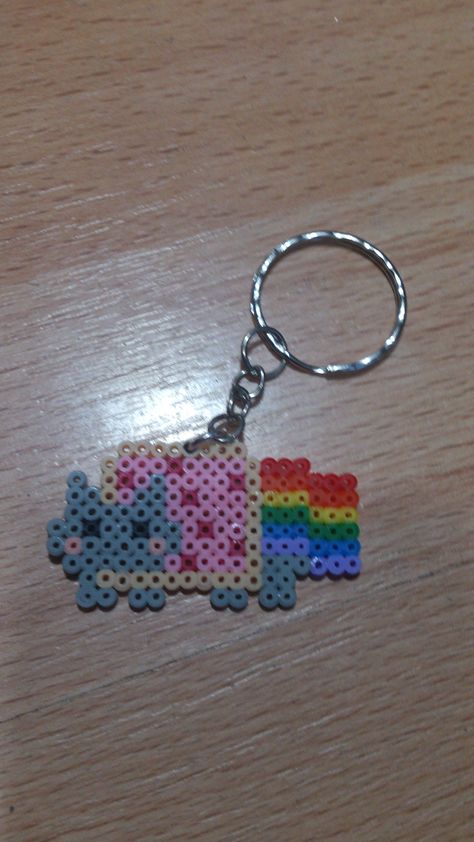 Nyan Cat Perler Bead Nyan Cat, 14x14 Pixel Art, Nyan Cat Perler Beads, Perler Beads Keychain, Kandi Keychain, Perler Bead Keychain, Melty Bead Designs, Melt Beads Patterns, Kandi Inspo