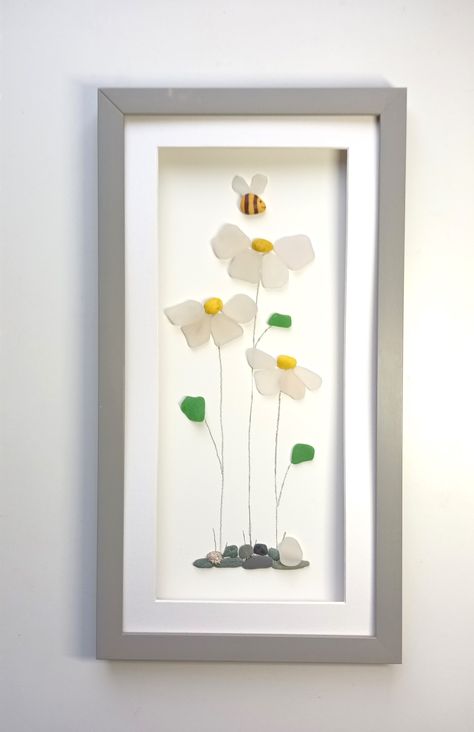 set inside a long (44cm x 24cm) glass fronted frame #seaglass #daisy #daisies #flowers #wildflowers #bee #floral #wallart #giftsforher #mothersday #FREEDELIVERY Sea Glass Artwork Flowers, Seaglass Flower Art, Sea Glass Flower Art, Seaglass Art Ideas, Seaglass Flowers, Sea Glass Flowers, Rock Pictures, Sea Glass Artwork, Sea Glass Art Diy