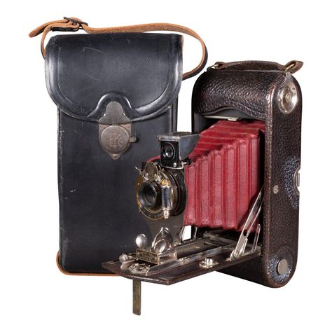 ABOUT  An original large Eastman Kodak No. 2C folding pocket camera with red bellows. The body is wrapped in leather with chrome and brass accents. The camera folds to 2.25 inches. Original leather case with brass lock. The camera may or may not work but is sold as a decorative objects.      CREATOR Eastman Kodak Company, USA.     DATE OF MANUFACTURE c.1914.     MATERIALS AND TECHNIQUES Metal, Leather, Chrome, Brass, Fabric.     CONDITION Good. Wear consistent with age and use. The bellows appea Chrome And Brass, Postcard Format, Chrome Brass, Beginner Yoga Workout, Folding Camera, Pocket Camera, Antique Cameras, Kodak Moment, Retro Gadgets