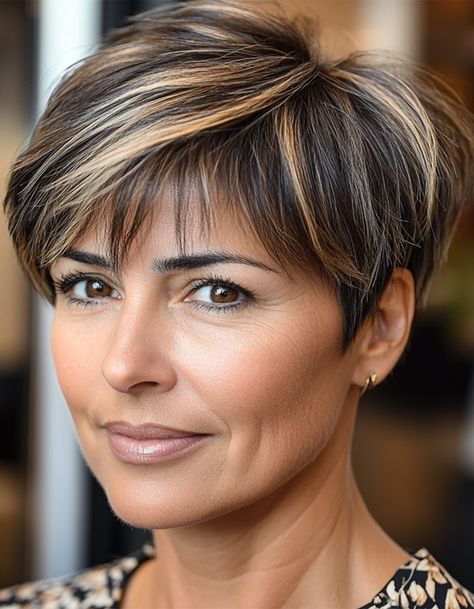 17. Chic Brunette Pixie with Highlights This chic brunette pixie haircut is effortlessly stylish, with subtle highlights that add texture and dimension to the darker base. The short, neat layers keep this look fresh and modern while being super low-maintenance. Short Haircuts With Highlights Brunettes, Brunette Pixie Haircut, Brunette Pixie With Highlights, Pixie With Highlights, Haircut For Women Over 50, Pixie Haircut For Women, Pixie Hair Color, Pixie Haircuts For Women, Brunette Pixie